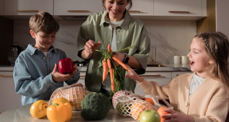 A family enjoys quality time in the kitchen, preparing a meal with fresh vegetables.
